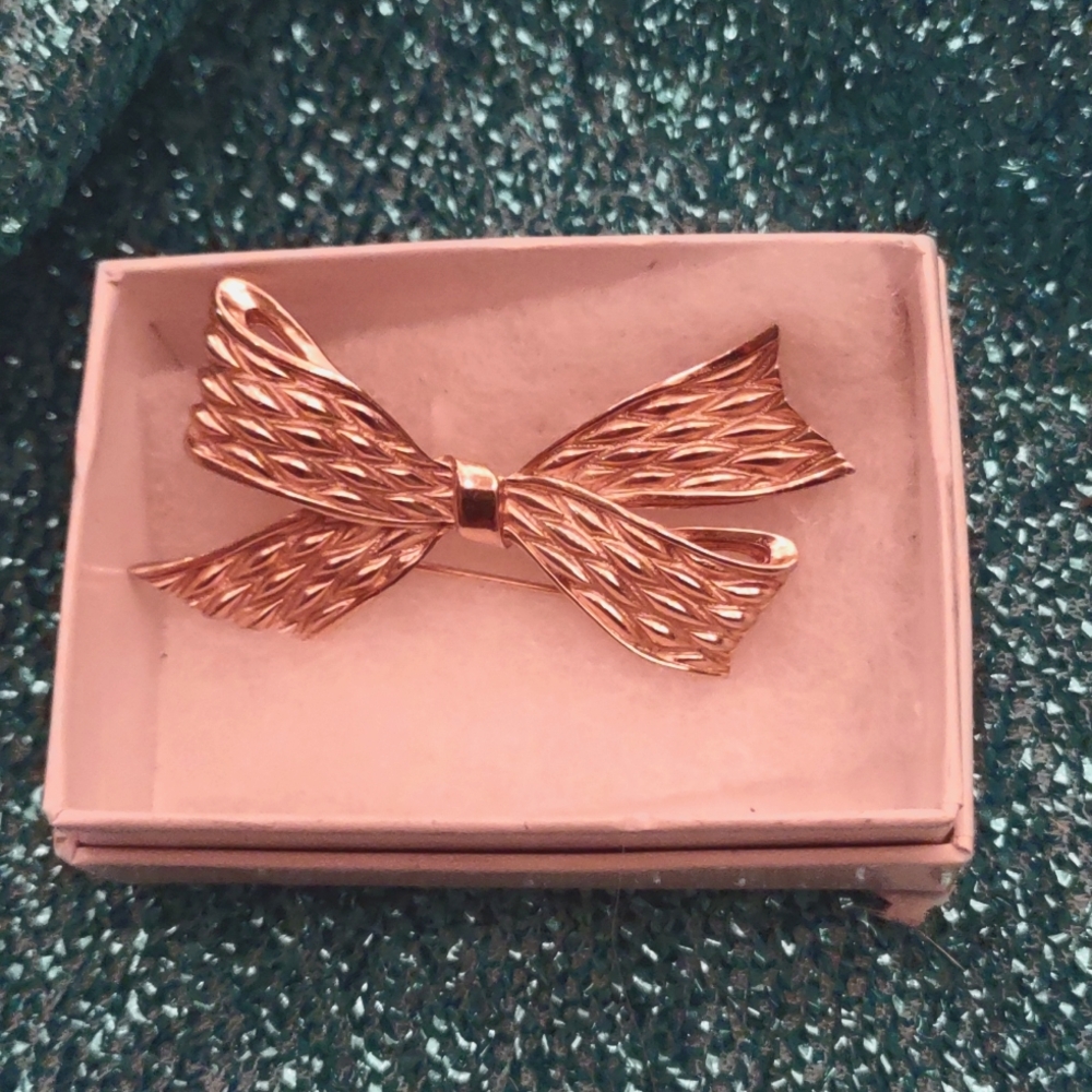 Gold tone Trifari (crown T mark) Bow brooch.